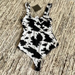 Cow print body suit